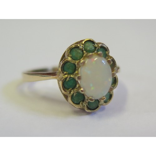 891b - A 9ct Yellow Gold, White Opal and Peridot Ring, size K.5, 2.3g