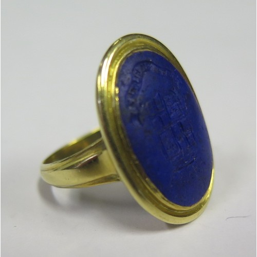 875 - A Georgian Period Lapis Lazuli Seal Ring in an unmarked gold setting, helix 18x13mm, size G, 5.8g