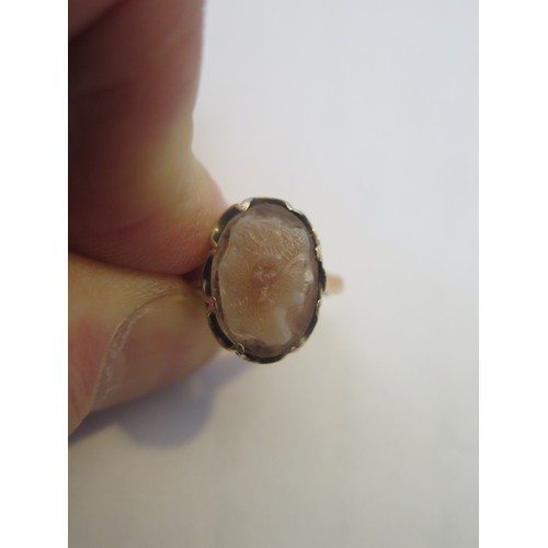 808 - An Hardstone Twin Head Cameo Ring decorated with the bust of a lady and and a man, in an unmarked go... 