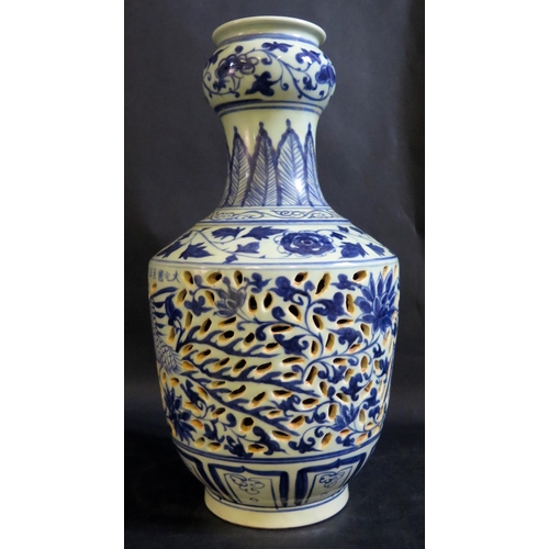 1017g - A Chinese Republican Period Blue and White Porcelain Vase with pierced body and decorated with birds... 