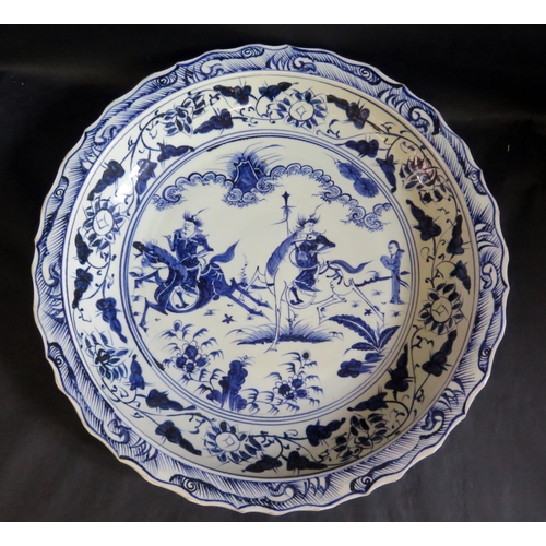 1017O - A Large Chinese Republican Period Blue and White Porcelain Shallow Dish painted with warriors in a l... 