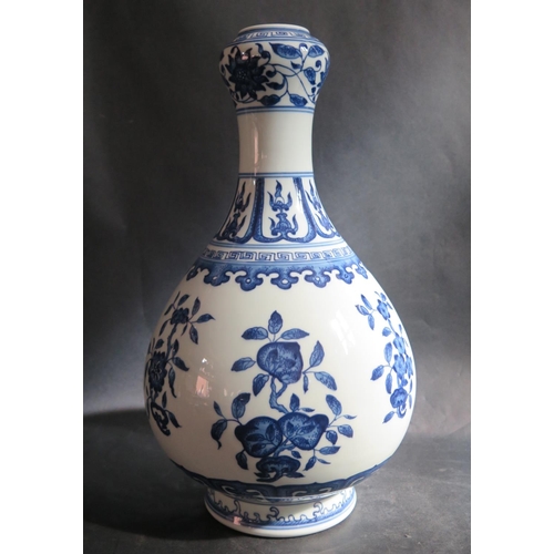 1017p - A Chinese Republican Period Blue and White Porcelain Ewer painted with foliate work, 34cm high