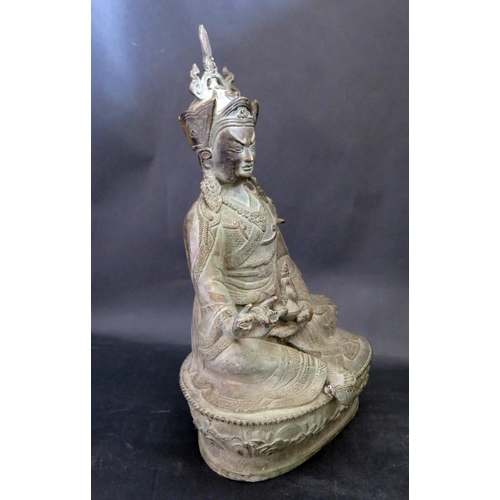 1017X - A Chinese Bronze Alloy Seated Buddha on a lotus blossom base, 34cm high