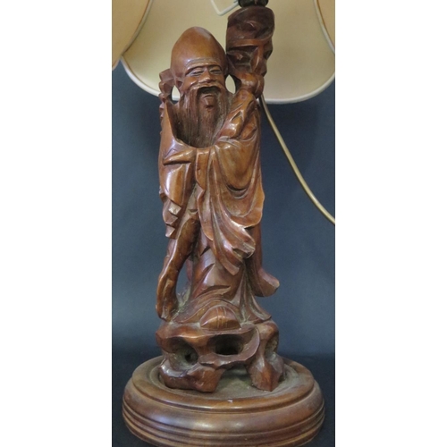 1019 - A Chinese Carved Wooden Immortal Table Lamp, 63cm inc. shade