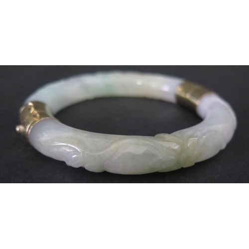 1056 - A Chinese Carved Jade Hinged Bangle with 10K gold clasp, 58mm inside diam.