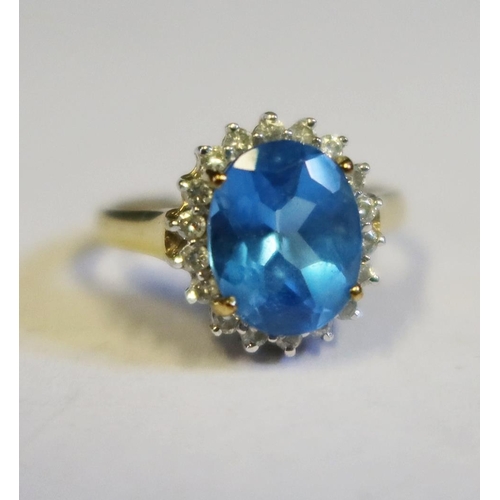 107 - A 9ct Gold, Blue Topaz and Diamond Ring, size N, 3.3g