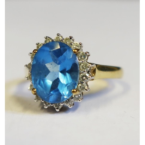 107 - A 9ct Gold, Blue Topaz and Diamond Ring, size N, 3.3g