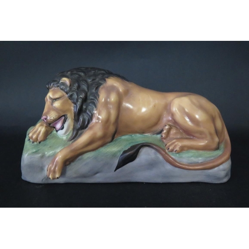 1074 - Michael Sutty Porcelain Recumbent Lion, base c. 22cm