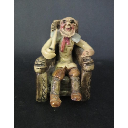 1084 - A Will Young Seated Figure with pipe, 8cm high and figurine