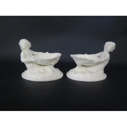 1088 - A Pair of Royal Worcester Merboy and Scallop Shell Salts, 9.5cm tall