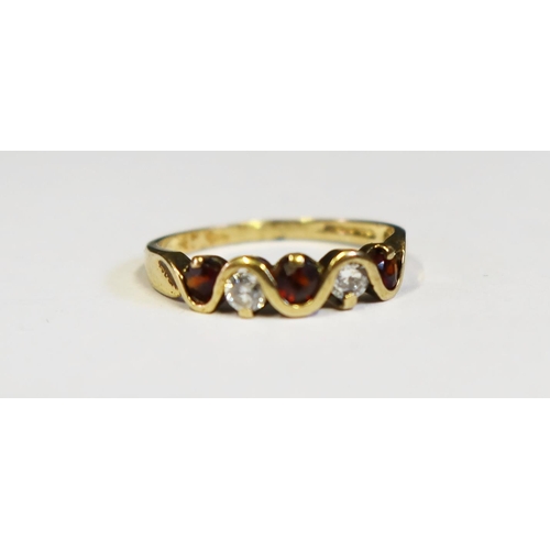 109 - A 9ct Gold, Garnet and CZ Ring, size Q.5, 1.9g