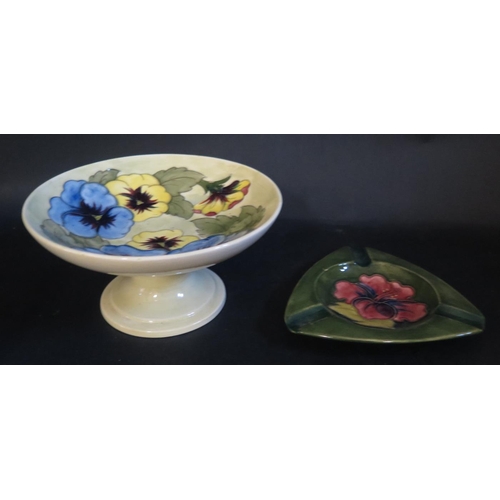 1133 - A W. Moorcroft Pansy Decorated Footed Bowl (18cm diam.) and ashtray, both with Queen Mary stickers t... 