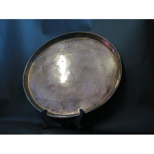 1156b - A Chased Copper Tray dated 1893, 45cm diam.