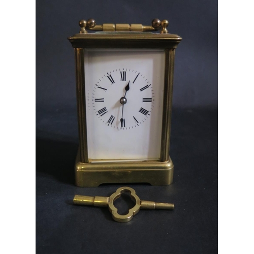 1222 - A Striking Brass Carriage Clock by R & C. and with key, overwound, spring balance good, 16cm to top ... 