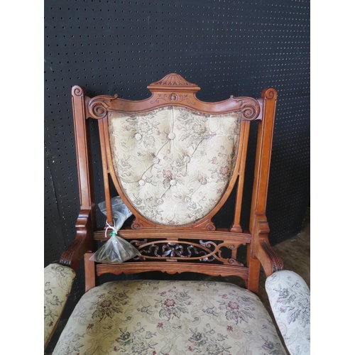 1268 - An Edwardian Carved Open Arm Chair and bag of loose castors