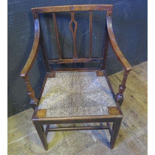 1269 - An 18th Century Carved Oak Carver Chair with drop in rush seated seat