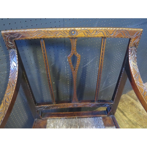 1269 - An 18th Century Carved Oak Carver Chair with drop in rush seated seat