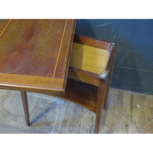 1310 - A 1920's Mahogany and Strung Fold Over Card Table