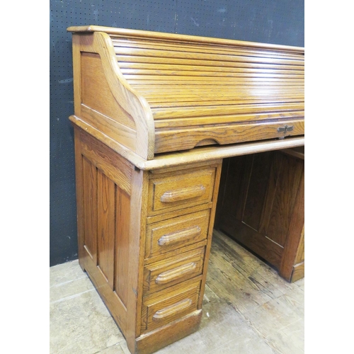 1312 - A 1930's Oak Roll Top Desk with key, 122(w)x110(h)x66(d)cm