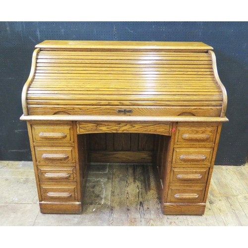 1312 - A 1930's Oak Roll Top Desk with key, 122(w)x110(h)x66(d)cm