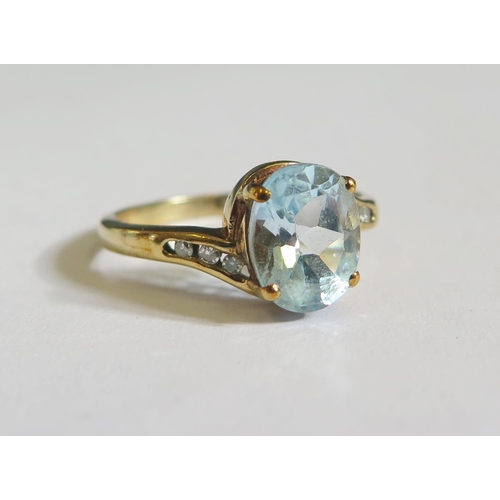 134 - A 9ct Gold, Blue Topaz and Diamond Ring, size N, 2.5g