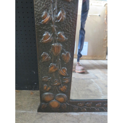 1437a - An Art Nouveau Copper Mirror with embossed fruiting foliate work, 106cm width x 89cm height