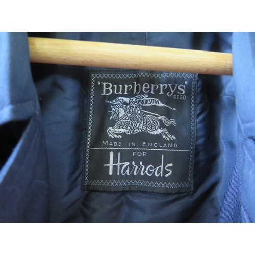 1443 - A Burberrys for Harrods Gent's Navy Blue Coat with wool liner, approx. 46