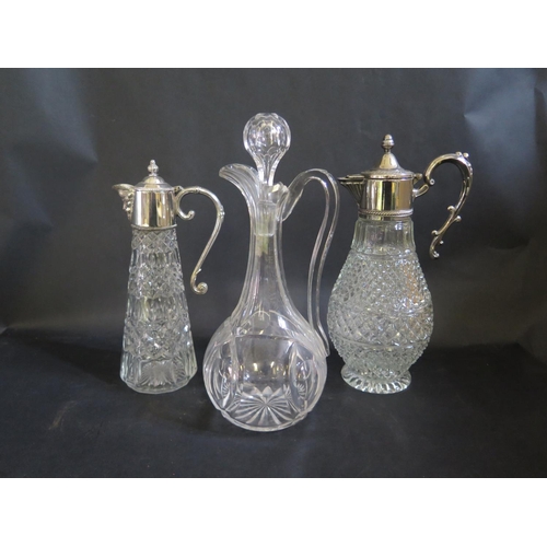 1552 - A Cut Crystal Claret Jug and two with plated mounts