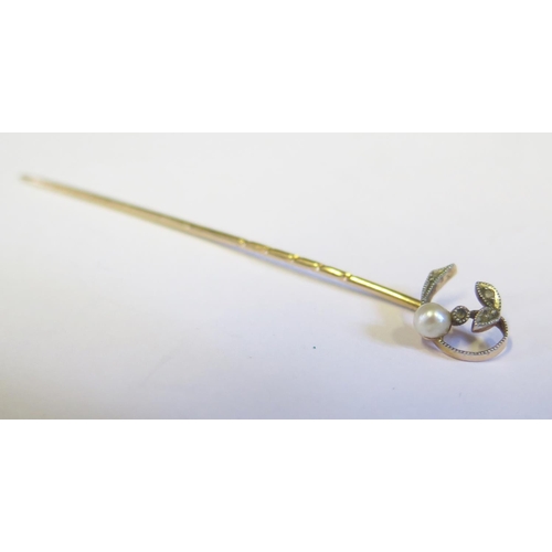 222 - A Cased Pearl and Diamond Pin in a gold setting (unclear marks), 7cm, 1.8g