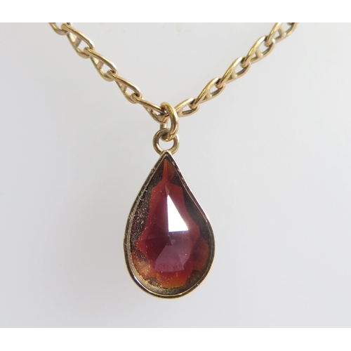 271 - A 9ct Gold and Garnet Pendant Necklace, 40cm, c. 19mm drop, 5.2g