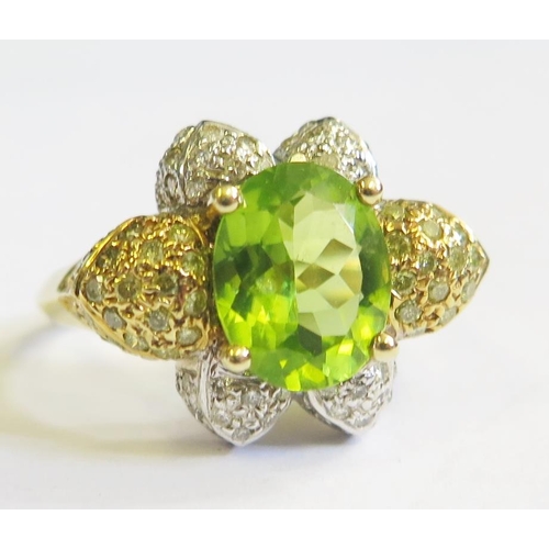 284 - A 14ct White and Yellow Gold Peridot Ring, head of ring 20mm, size T, 5.8g