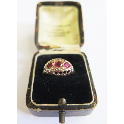 295 - A 9ct Gold and Three Stone Ruby Ring, Chester hallmarks, size N, 2g