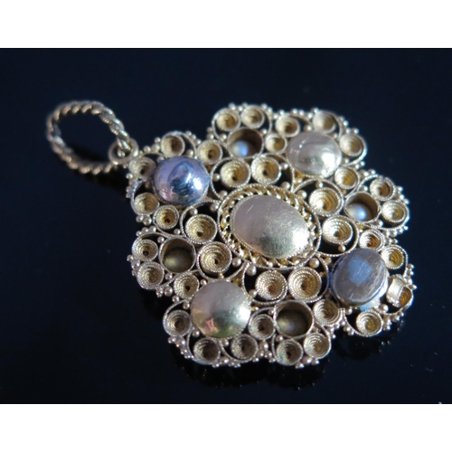 299 - A Georgian Turquoise and Silver Pearl Set Pendant in  an unmarked high carat gold setting, 40mm drop... 