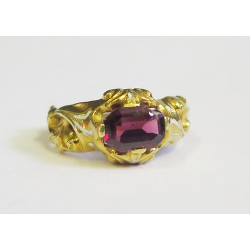 304 - A Georgian Garnet Ring with white foliate enamel shoulders in a high carat intricate foliate mount, ... 