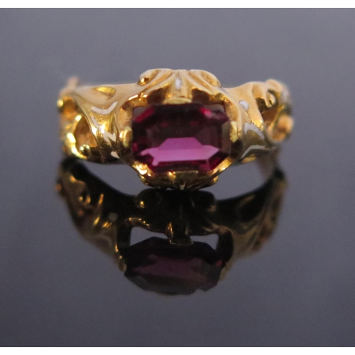 304 - A Georgian Garnet Ring with white foliate enamel shoulders in a high carat intricate foliate mount, ... 