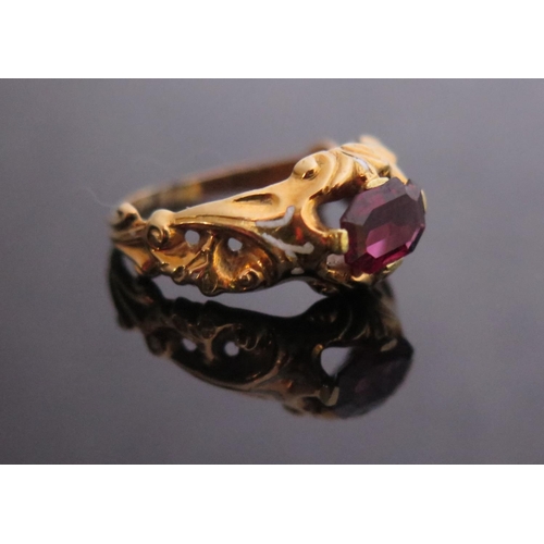 304 - A Georgian Garnet Ring with white foliate enamel shoulders in a high carat intricate foliate mount, ... 