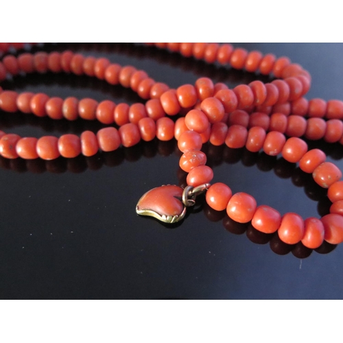 308 - A Georgian Coral Bead Necklace with carved heart pendant, 75cm, 50g, beads c. 6.5mm