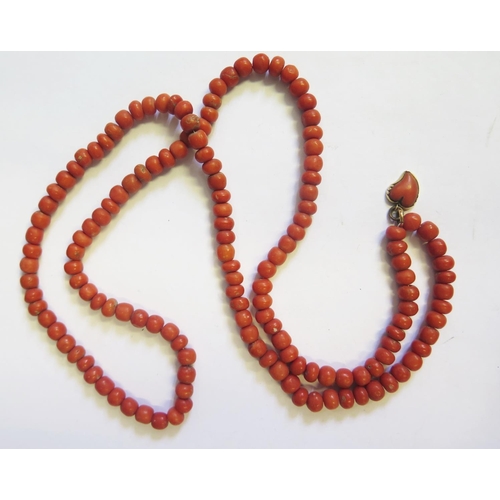 308 - A Georgian Coral Bead Necklace with carved heart pendant, 75cm, 50g, beads c. 6.5mm