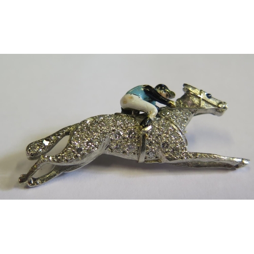 328 - An Antique Enamel, Sapphire and Diamond Encrusted Horse and Jockey Brooch in an unmarked platinum or... 