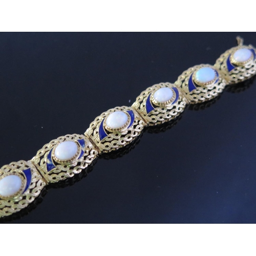 335 - An 18ct Yellow Gold, White Opal and Blue Enamel Bracelet, 18cm long x 1.5cm wide, opals c. 9x6mm, 26... 