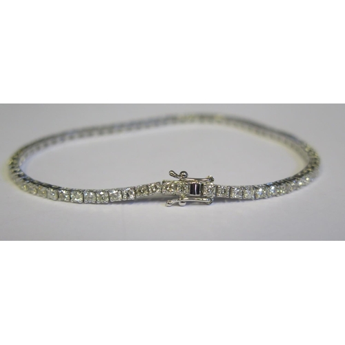 337 - An 18ct White Gold and 3.5ct Diamond Line Bracelet, set with seventy stones, c. 18.5cm, 8.4g