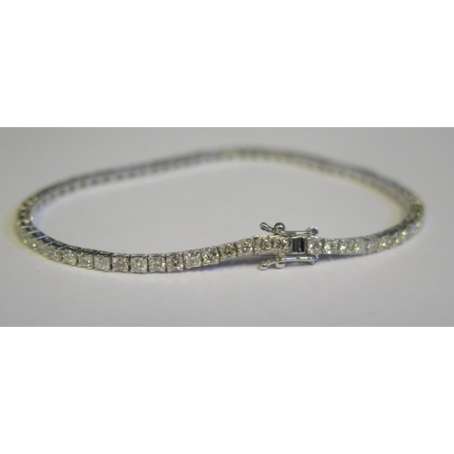 337 - An 18ct White Gold and 3.5ct Diamond Line Bracelet, set with seventy stones, c. 18.5cm, 8.4g