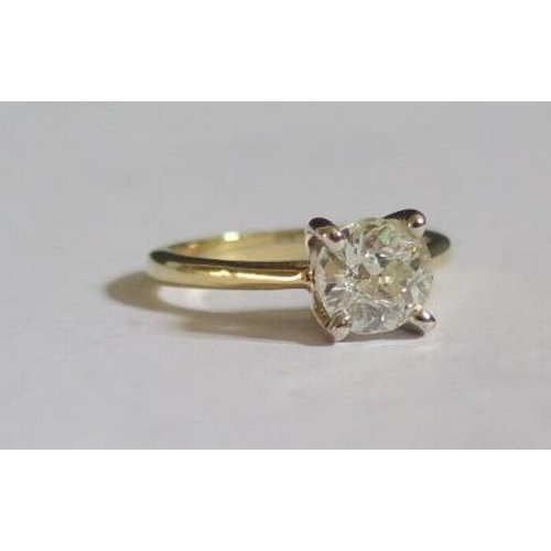 372 - A 1.5ct Diamond Solitaire Ring in an 18ct yellow gold shank with white gold claw setting, size N.5, ... 