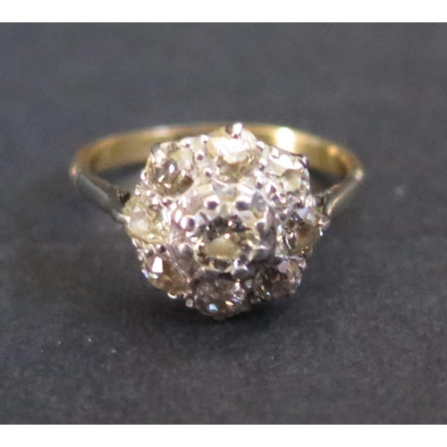 393 - A Diamond Cluster Ring in an unmarked gold setting, size J.5, 2.7g. EDW 1.25ct