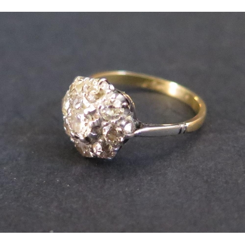 393 - A Diamond Cluster Ring in an unmarked gold setting, size J.5, 2.7g. EDW 1.25ct