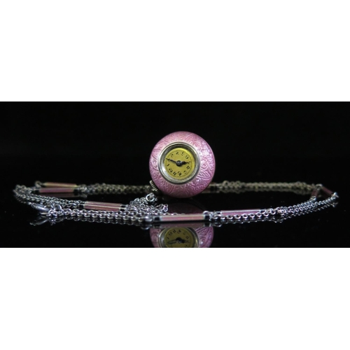 480 - A Pink Guilloché Enamel Ball Clock on matching chain, running, glass missing