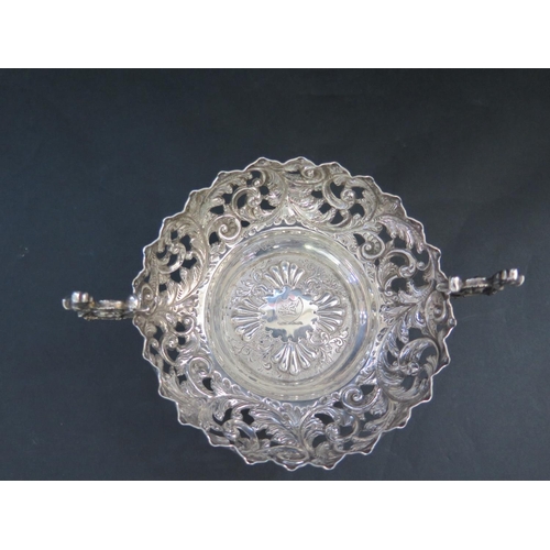 541 - A Victorian Pierced Silver Two Handled Bowl with embossed foliate scroll decoration, London 1892, Ch... 