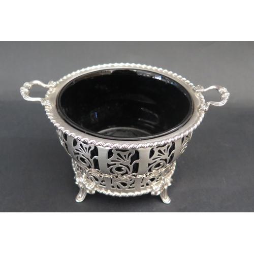 558 - An Elizabeth II Silver Two Handled Bowl with pierced foliate decoration and a blue glass liner, Birm... 