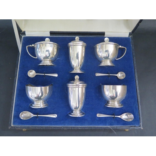 563 - A Cased George V Silver Six Part Cruet Set with four matching spoons, Birmingham 1937, Hukin & Heath... 