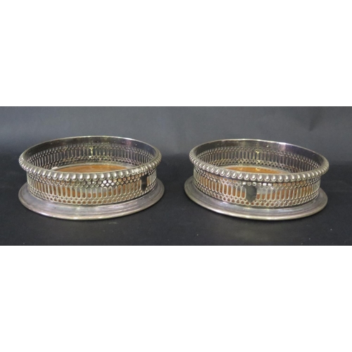 657 - A Pair of Silver Plated Wine Bottle Coasters